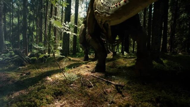Group of t rex tyrannosaurus walking in the middle of a jurassic forest, seen from behind, dinosaurs
