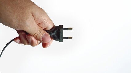 hand with electric plug