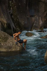 Fototapeta na wymiar asian going for a swim in a river
