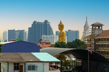 Huge Buddha image that appears between the buildings. big buddha Buddha image on the roof of...