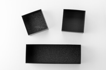 Packing in an open black gift box, black box on white background