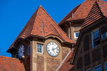 Fototapeta na wymiar old historic clock tower on roof 