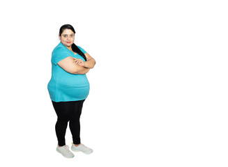 Overweight fat indian woman standing with cross arm standing isolated over white background, studio...