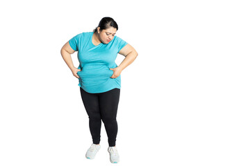 Fototapeta na wymiar Sad overweight indian woman holding big belly waistline suffering from excess fat. Worried Asian female heavy body size problem.weight loss concept. Full length. Copy space.