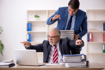 Two male colleagues working in the office