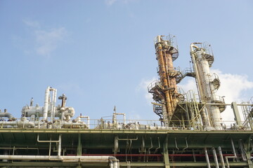 Oil and gas refining plant or petrochemical industry,support all factory in industrial Estate.and background blue sky. - 572532218