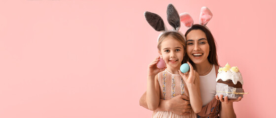 Little girl and her mother with tasty Easter cake and eggs on pink background with space for text