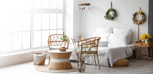 Interior of light bedroom decorated for Easter holiday