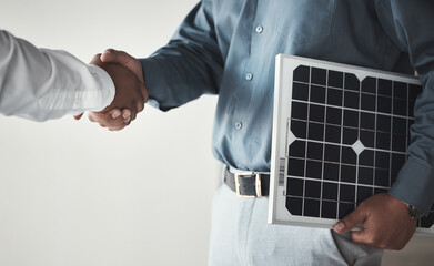 Closeup, handshake and business with solar panels, mockup and partnership for sustainability. Zoom, men and employees with gesture for collaboration, eco friendly or energy for electricity or meeting