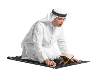 Praying Muslim man with Koran on white background