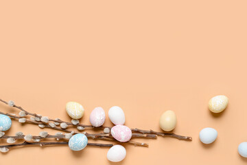 Composition with beautiful Easter eggs and willow branches on color background