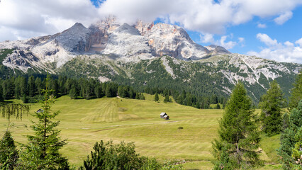 Fototapeta na wymiar Prato Piazza. Dolomites, Italy. A perspective of the ground's colors and shapes. Relaxing context. Traditional Alpine or Dolomites landscape. Amazing view of the hills and the mountains