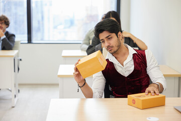 businessman checking parcel cardboard boxes from online shopping in the office