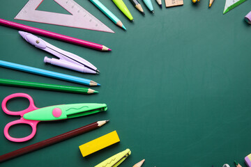 Frame made of school stationery on green chalkboard. Pi Day celebration