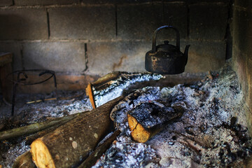 boil water in vintage kettle with firewoods