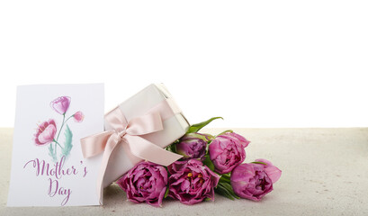 Greeting card with text MOTHER'S DAY, tulips and gift on table against white background