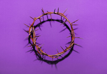 Crown of thorns on purple background. Good Friday concept