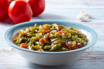Vegan salad of roasted peppers and tomatoes with onion. Healthy food.