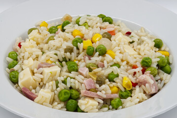 Oriental cantonese rice in a white plate isolated on white background