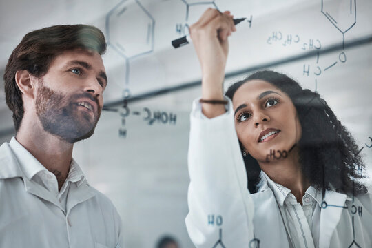 Teamwork, science and chemistry with people writing in laboratory for medicine, pharmacy or healthcare. Research, analytics and medical with scientists solving on glass board for idea, study or data