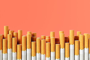 heap of cigarettes against orange background
