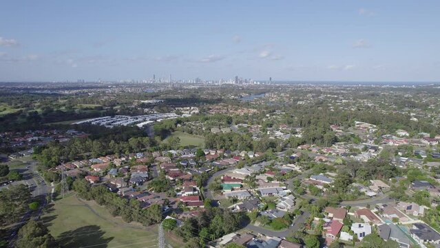 Townhouses In The Town Of Robina In Queensland, Australia. Surfers Paradise Skyline In Distant Background. wide aerial