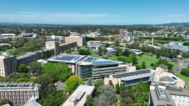 Drone shot of University of Queensland UQ St Lucia, drone orbiting UQ's Great Court and Forgan Smith Building. Shot during day time with clear blue skies. Brisbane QLD University 4K