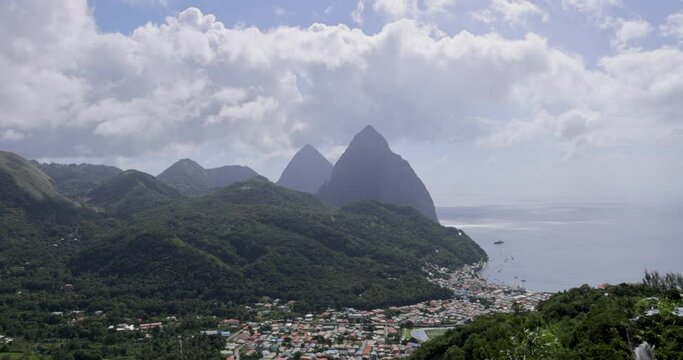 Twin volcanic Piton peaks of Petit Piton and Gros Piton overlook the harbor town of Soufiere on the Caribbean island of St. Lucia.