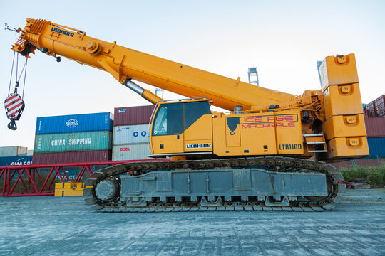 Constanta, Romania - 07.08.2022: A heavy crawler crane stands on the territory of a container terminal.