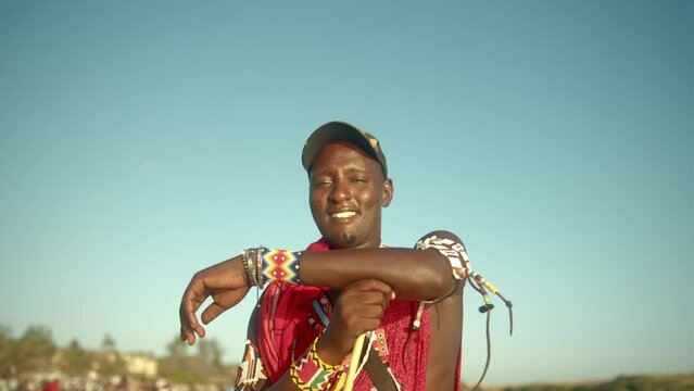 African Maasai Warrior Man Wearing Traditional Dress And Jewelry In Kenya. Close Up