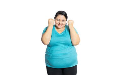 Cheerful overweight indian woman standing isolated over white studio background. Happy young plus size asian girl. Copy space.Closeup.