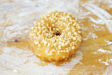 A donut, also called rosquilla, rosette, rosca or berlin, is a sweet bread roll that is traditionally fried in pork fat.                     