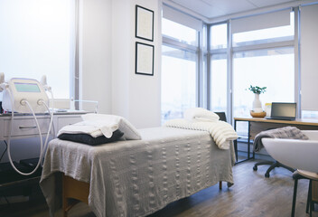 Bed, surgery and empty room for ophthalmology consultation, vision healthcare and laser exam. Clinic, healthcare and space for medical consulting on eyes, operation and empty eyesight office