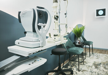 Machine, ophthalmology and laser in empty room of clinic for eye exam, laser and consulting. Healthcare, technology and interior with nobody in medical office for optometry, medicine and appointment