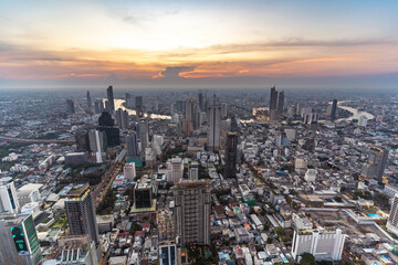 Fototapeta premium Bangkok cityscape top view and Chaophraya river in twilight time. Civilization city traveler and tourism destination with copy space.