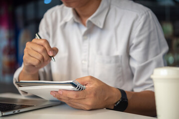 Education, development and intelligence cognition learning concept. Businessperson reading and writing on book.education studying knowledge development and cognition learning concept.