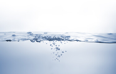 Water splash Aqua flowing in waves and creating bubbles Drops on the water surface feel fresh and clean isolated on white background.	