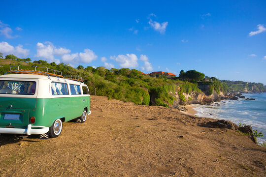 Retro bus at ocean coastline.