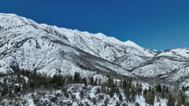 Aerial mountain canyon forest winter snow. Nebo Scenic Byway, Utah, national drive for beauty and nature. Beautiful season winter snow on Wasatch mountain forest. Travel destination. Alpine wil