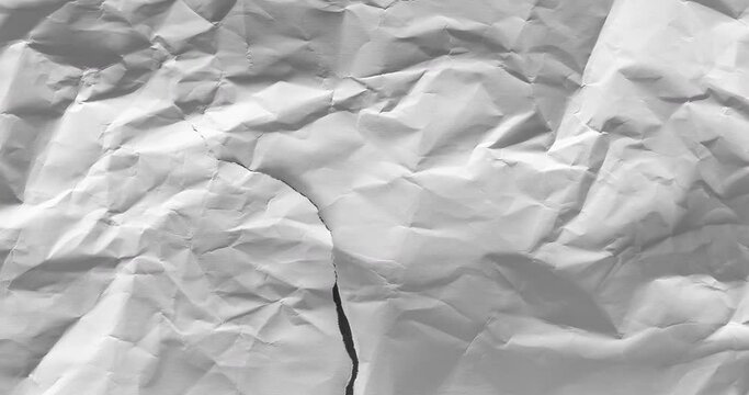 Stop motion animation of wrinkled white paper. Textured paper background. 4K loop animation