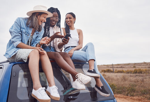 Car, road trip and happy friends with phone, social media post and countryside adventure on sky mockup space. South Africa group or diversity women. 5g smartphone and roof for travel journey together