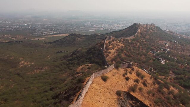 Aerial 4K shot of Bhujia fort and Smritivan during summer day at Bhuj, Kutch, India. Spectacular high aerial view of Bhujia Hill or Bhujiyo Dungar. Travel and holiday concept. 