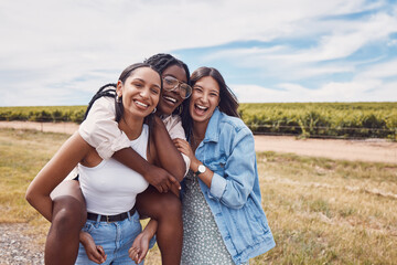Friends, portrait and piggyback of women on holiday, vacation or trip outdoors. Group freedom, comic adventure and happy girls laughing at joke, having fun or enjoying quality time together in nature