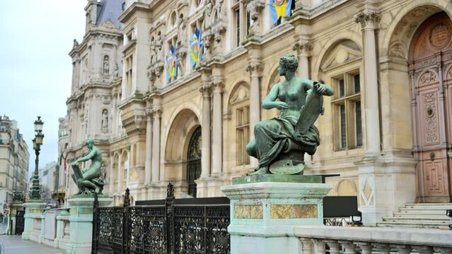 View of an old classic building exterior with emblems and antique lamppost in Paris, France