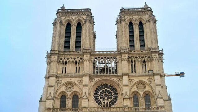 View of the Notre-Dame de Paris in Paris downtown, France. Cloudy sky