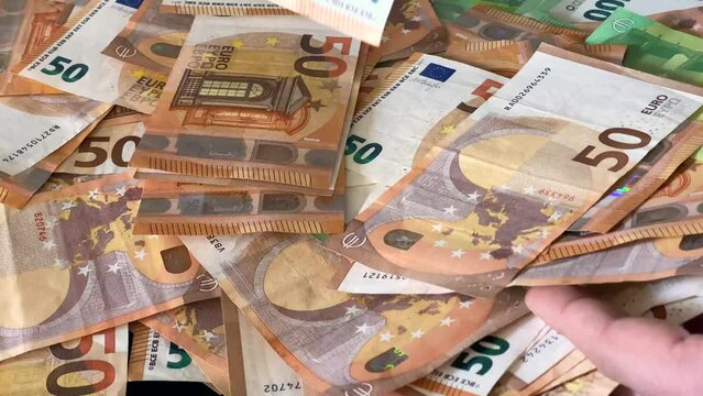 pile of money washing drug money. 50, 100 euro money banknotes bill close up. High Quality 4k Cinematic footage
