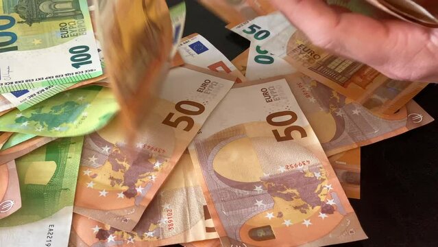 Scrape the last money together. 50, 100 euro money banknotes bill close up. High Quality 4k Cinematic footage