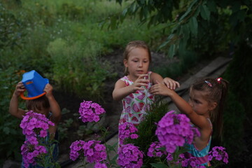 Obraz premium Beautiful children on a girls party in a blooming garden