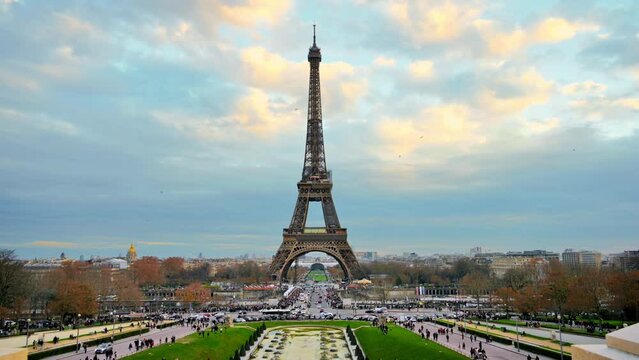 View of the Eiffel Tower in Paris from the Trocadero Square, France. Gardens of the Trocadero with multiple people
