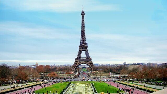 View of the Eiffel Tower in Paris from the Trocadero Square, France. Gardens of the Trocadero with multiple people